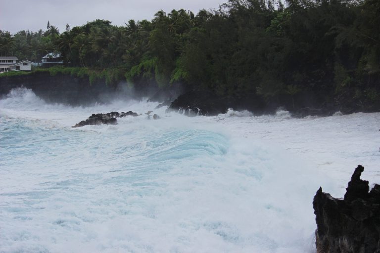 White water exploding against a lava shoreline